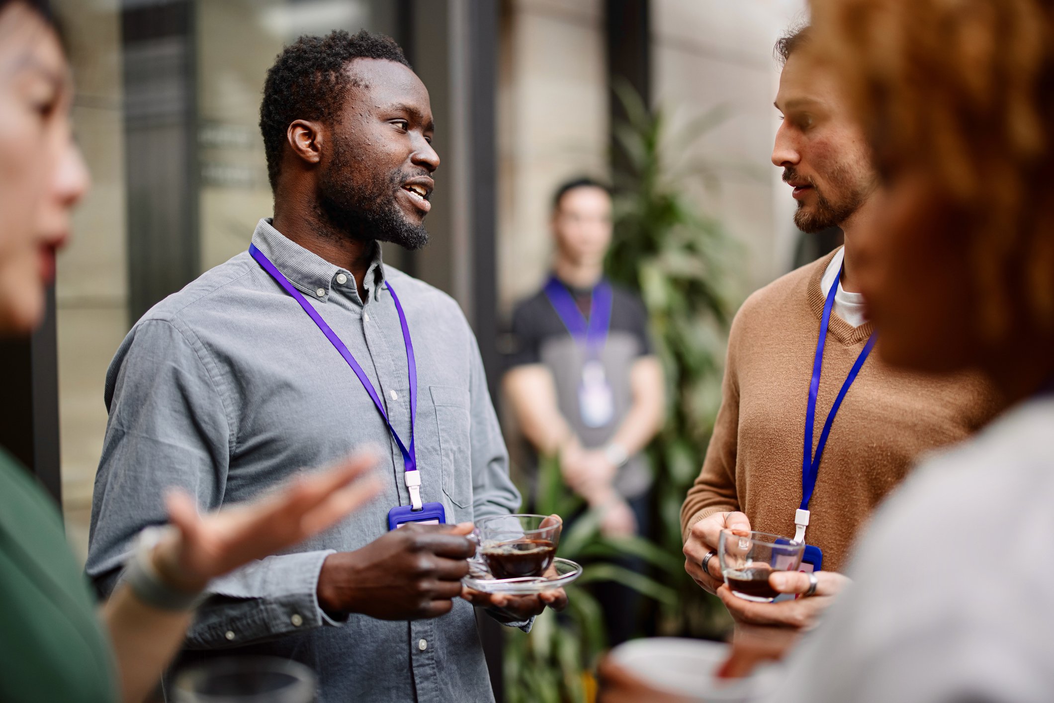 Two men speaking at an event