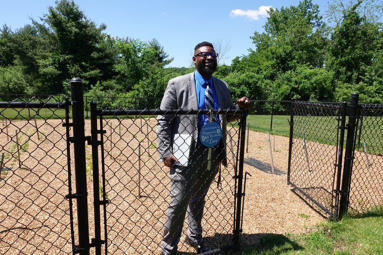 Man standing in garden plot