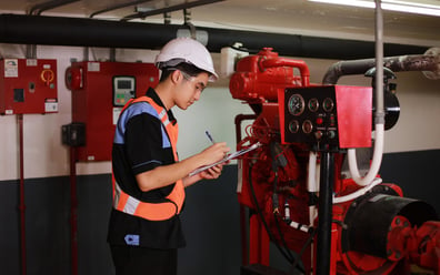 Man monitoring fire safety equipment