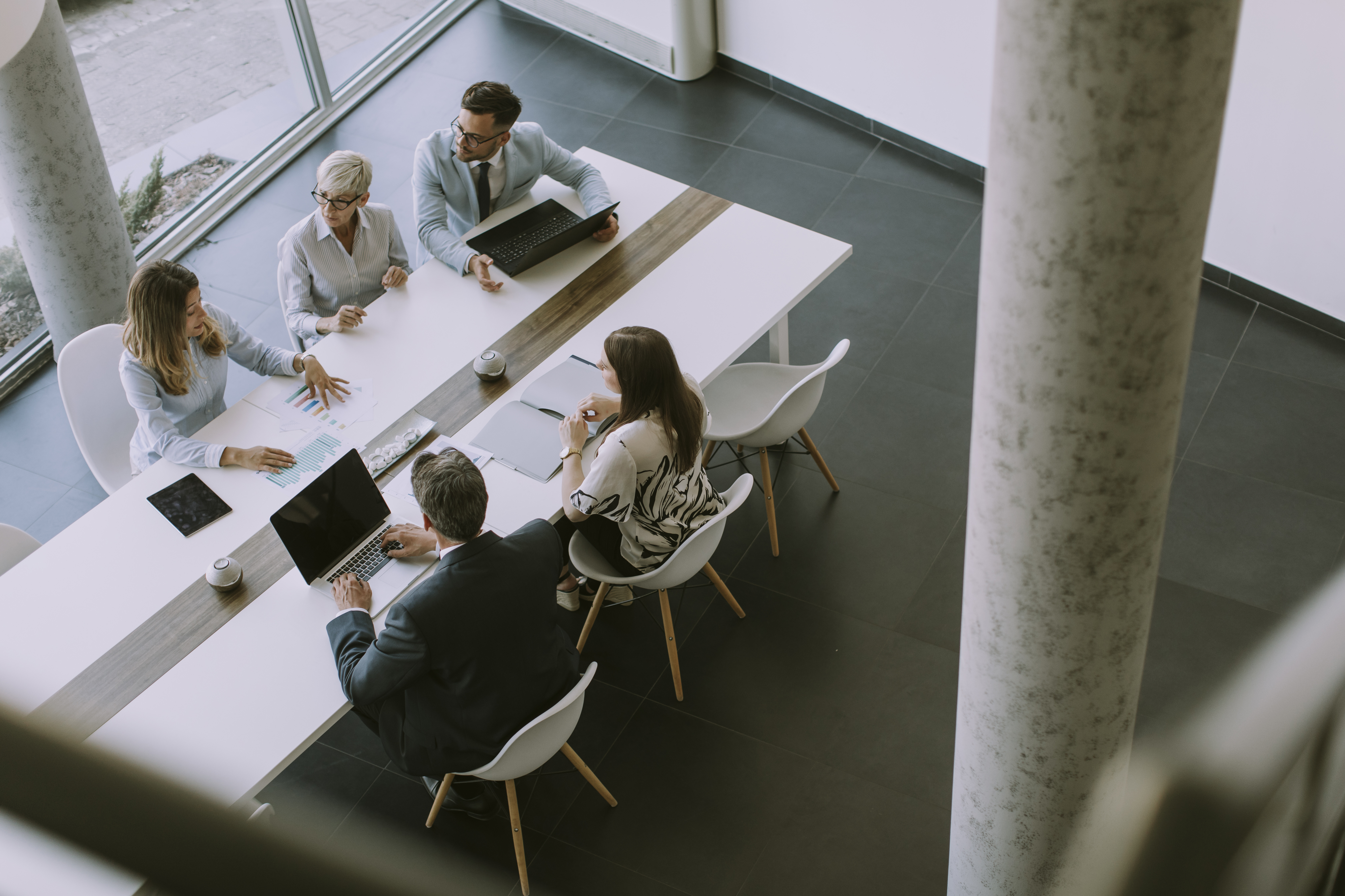 Employees meeting around conference table