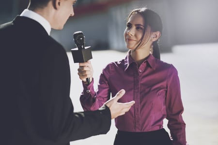 Man being interviewed by reporter