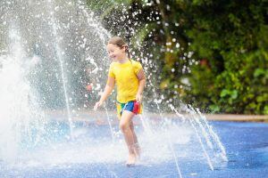 Playing in splash pad