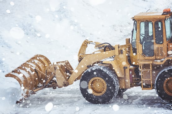 Truck pushing snow